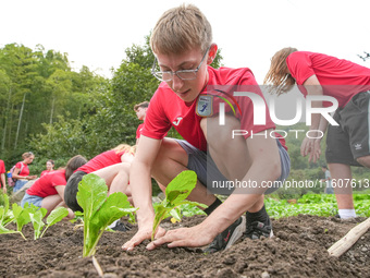 Middle school students from the United Kingdom grow vegetables in Houwu village, Moganshan town, Deqing County, Huzhou city, East China's Zh...