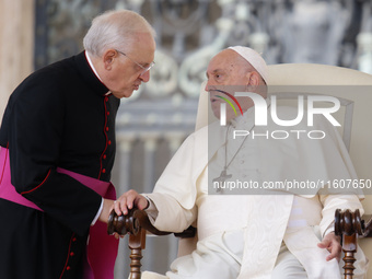 Pope Francis talks with Leonardo Sapienza at the end of his Wednesday general audience in Saint Peter's Square, Vatican City, on September 2...