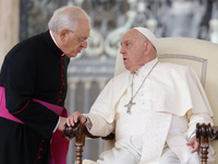 Pope Francis talks with Leonardo Sapienza at the end of his Wednesday general audience in Saint Peter's Square, Vatican City, on September 2...