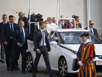 Pope Francis sits on a Toyota Mirai hydrogen-powered popemobile at the end of the weekly general audience in The Vatican, on September 25, 2...