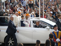 Pope Francis sits on a Toyota Mirai hydrogen-powered popemobile at the end of the weekly general audience in The Vatican, on September 25, 2...