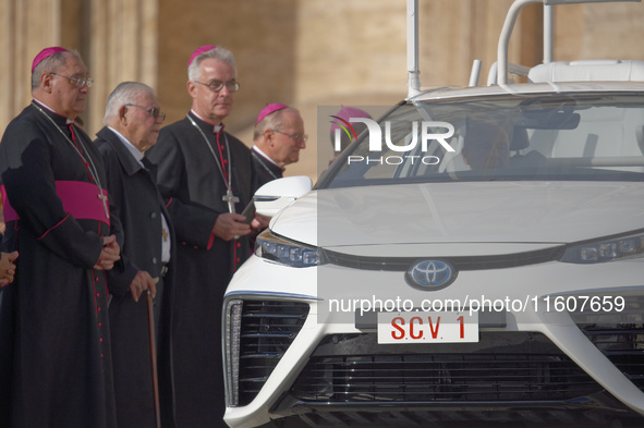 The Toyota Mirai hydrogen-powered popemobile leaves St. Peter's Square at the end of the weekly general audience in The Vatican, on Septembe...