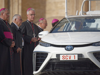 The Toyota Mirai hydrogen-powered popemobile leaves St. Peter's Square at the end of the weekly general audience in The Vatican, on Septembe...