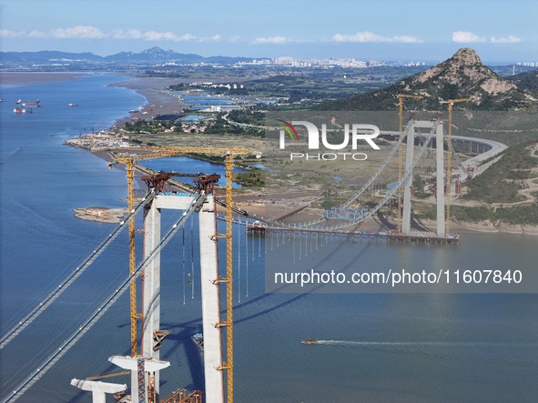 The installation and construction of suspension cables at the construction site of Rushankou Cross Sea Bridge take place in Weihai, China, o...