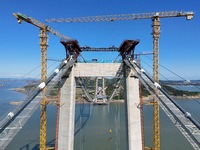 The installation and construction of suspension cables at the construction site of Rushankou Cross Sea Bridge take place in Weihai, China, o...