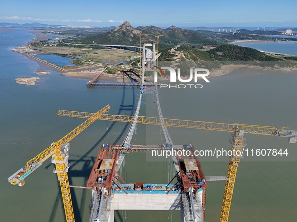 The installation and construction of suspension cables at the construction site of Rushankou Cross Sea Bridge take place in Weihai, China, o...