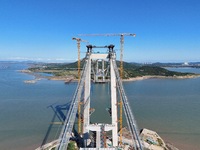 The installation and construction of suspension cables at the construction site of Rushankou Cross Sea Bridge take place in Weihai, China, o...