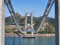 The installation and construction of suspension cables at the construction site of Rushankou Cross Sea Bridge take place in Weihai, China, o...