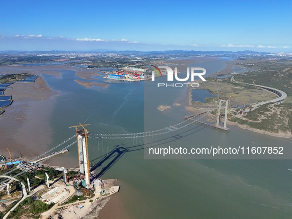 The installation and construction of suspension cables at the construction site of Rushankou Cross Sea Bridge take place in Weihai, China, o...