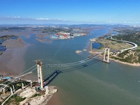 The installation and construction of suspension cables at the construction site of Rushankou Cross Sea Bridge take place in Weihai, China, o...