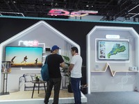 Visitors visit the ''5G Home Video System'' at the booth of China Broadcasting and Television at the 2024 China International Information an...