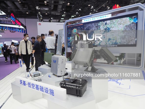 Visitors visit the ''Low-altitude Flight Service Regulatory Platform System'' at the booth of China Telecom at the 2024 China International...