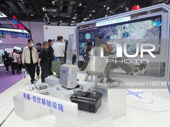 Visitors visit the ''Low-altitude Flight Service Regulatory Platform System'' at the booth of China Telecom at the 2024 China International...