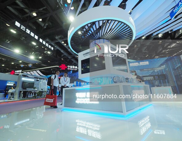 Visitors visit the ''5G Special Fiber'' at the 2024 China International Information and Communication Exhibition in Beijing, China, on Septe...