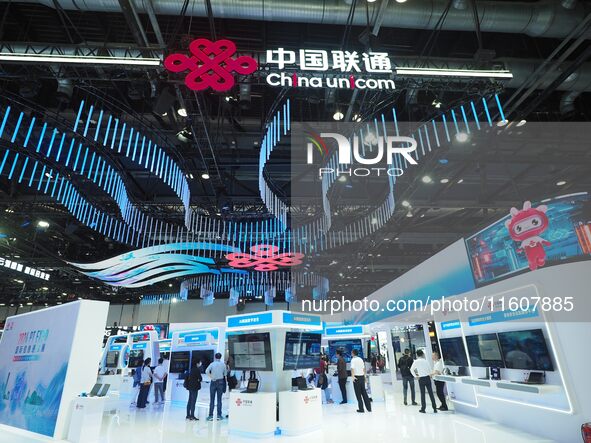 Visitors visit the booth of China Unicom at the China International Information and Communications Exhibition 2024 in Beijing, China, on Sep...