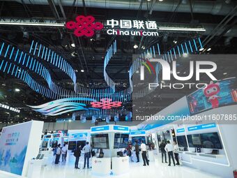 Visitors visit the booth of China Unicom at the China International Information and Communications Exhibition 2024 in Beijing, China, on Sep...