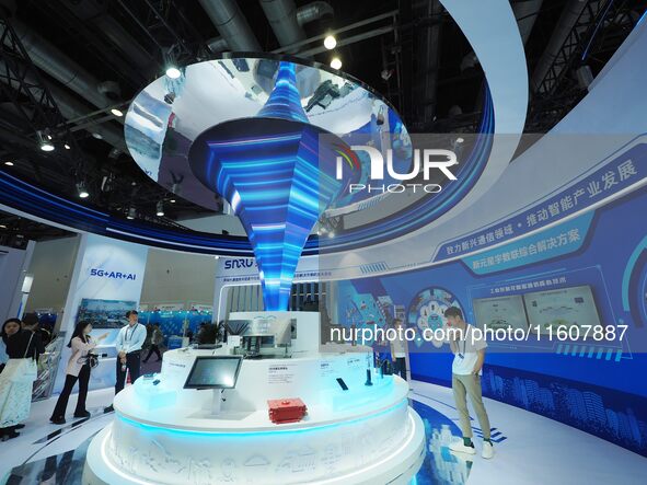 Visitors view ''5G network equipment'' at the China International Information and Communication Exhibition 2024 in Beijing, China, on Septem...