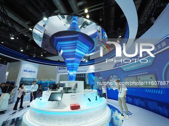 Visitors view ''5G network equipment'' at the China International Information and Communication Exhibition 2024 in Beijing, China, on Septem...