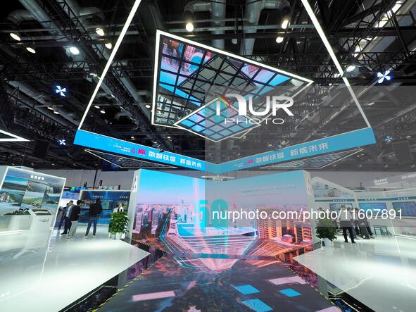 Visitors visit the booth of China Tower at the 2024 China International Information and Communication Exhibition in Beijing, China, on Septe...