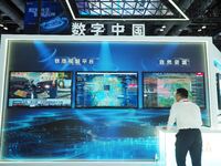 Visitors visit the ''Tower Visual Link Platform System'' at the booth of China Tower at the 2024 China International Information and Communi...