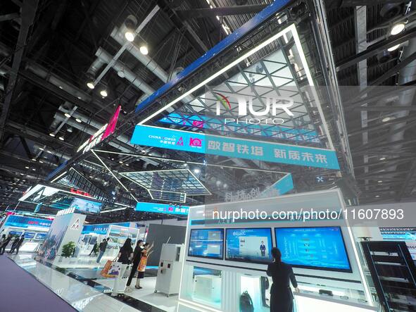 Visitors visit the booth of China Tower at the 2024 China International Information and Communication Exhibition in Beijing, China, on Septe...