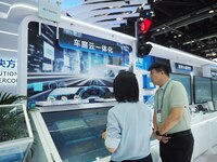 Visitors visit the ''Vehicle, Road and Cloud Integration System'' at the booth of Sintech at the 2024 China International Information and Co...