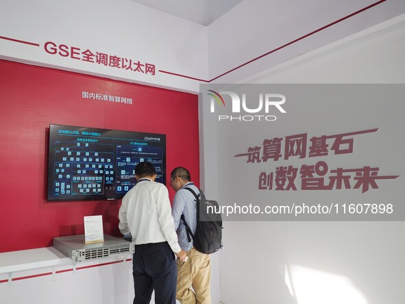 Visitors visit a ''Data center switch'' at the China International Information and Communication Exhibition 2024 in Beijing, China, on Septe...