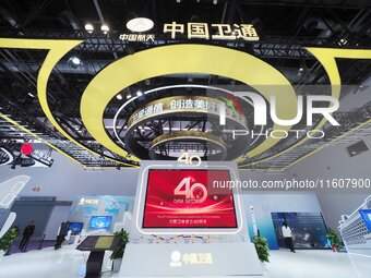 Visitors visit the booth of China Satcom at the 2024 China International Information and Communications Exhibition in Beijing, China, on Sep...