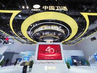 Visitors visit the booth of China Satcom at the 2024 China International Information and Communications Exhibition in Beijing, China, on Sep...