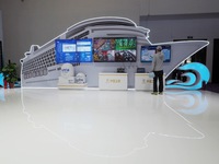 Visitors visit the ''Haixingtong Shipboard Terminal System'' at the booth of China Satcom at the 2024 China International Information and Co...