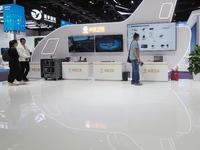 Visitors visit the ''Aircraft Real-time Data System'' at the booth of China Satcom at the 2024 China International Information and Communica...