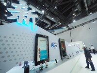 Visitors visit the ''5G smartphone'' at the booth of ZTE at the China International Information and Communications Exhibition 2024 in Beijin...