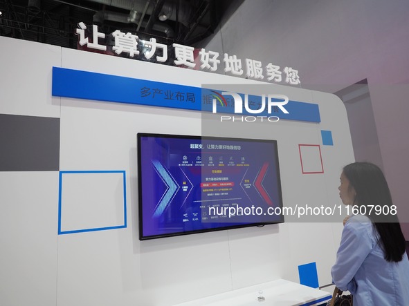 The audience visits the ''AI Big Model System'' at the 2024 China International Information and Communication Exhibition in Beijing, China,...