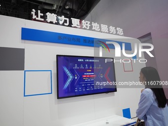 The audience visits the ''AI Big Model System'' at the 2024 China International Information and Communication Exhibition in Beijing, China,...