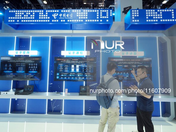 The audience visits the ''Quantum Computing'' booth of China Telecom at the 2024 China International Information and Communication Exhibitio...