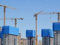 Tower cranes are seen at a real estate construction site in Beijing, China, on September 12, 2024. On September 24, 2024, the press conferen...