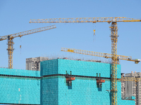 Tower cranes are seen at a real estate construction site in Beijing, China, on September 12, 2024. On September 24, 2024, the press conferen...