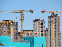 Tower cranes are seen at a real estate construction site in Beijing, China, on September 12, 2024. On September 24, 2024, the press conferen...