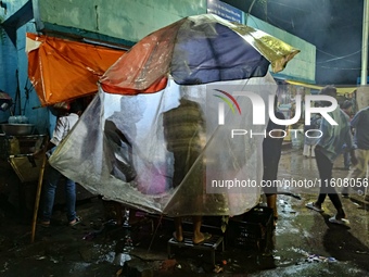 Heavy monsoon rains occur in Kolkata, West Bengal, India, on September 25, 2024. (