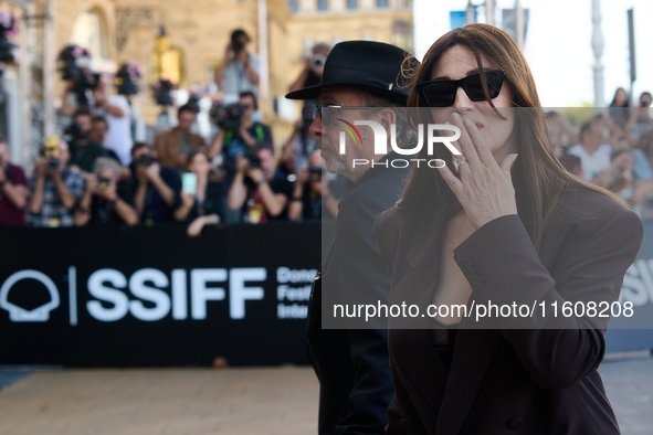 Monica Bellucci and Tim Burton arrive at the Maria Cristina Hotel during the 72nd San Sebastian International Film Festival in San Sebastian...