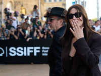 Monica Bellucci and Tim Burton arrive at the Maria Cristina Hotel during the 72nd San Sebastian International Film Festival in San Sebastian...