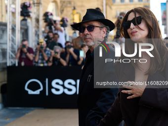 Monica Bellucci and Tim Burton arrive at the Maria Cristina Hotel during the 72nd San Sebastian International Film Festival in San Sebastian...