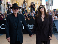 Monica Bellucci and Tim Burton arrive at the Maria Cristina Hotel during the 72nd San Sebastian International Film Festival in San Sebastian...