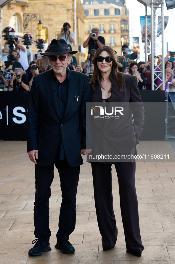 Monica Bellucci and Tim Burton arrive at the Maria Cristina Hotel during the 72nd San Sebastian International Film Festival in San Sebastian...