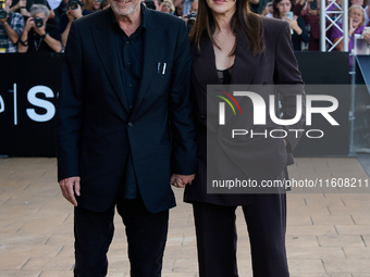 Monica Bellucci and Tim Burton arrive at the Maria Cristina Hotel during the 72nd San Sebastian International Film Festival in San Sebastian...