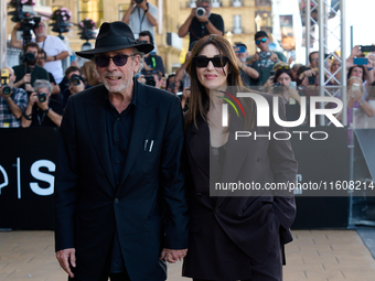 Monica Bellucci and Tim Burton arrive at the Maria Cristina Hotel during the 72nd San Sebastian International Film Festival in San Sebastian...