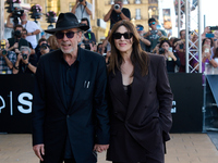 Monica Bellucci and Tim Burton arrive at the Maria Cristina Hotel during the 72nd San Sebastian International Film Festival in San Sebastian...