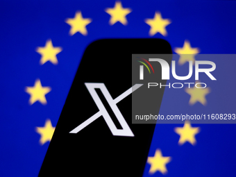 European Union flag displayed on a laptop screen and X logo displayed on a phone screen are seen in this illustration photo taken in Krakow,...