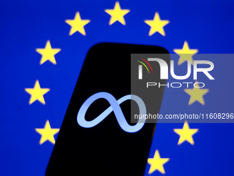 European Union flag displayed on a laptop screen and Meta logo displayed on a phone screen are seen in this illustration photo taken in Krak...