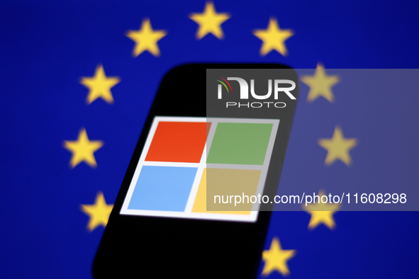 European Union flag displayed on a laptop screen and Microsoft logo displayed on a phone screen are seen in this illustration photo taken in...